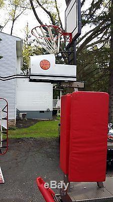 The DOMINTOR Shoot A Way Basketball Post Training Station Machine Hoop Rebound